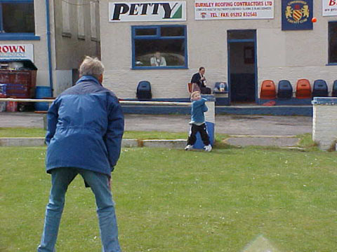 spectators playing cricket