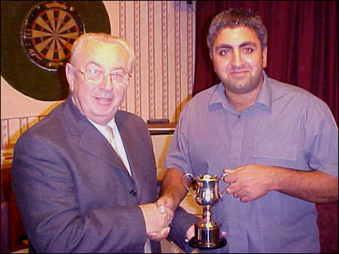 Peter Barratt presents Saf Ali with the Michael Rigby Trophy